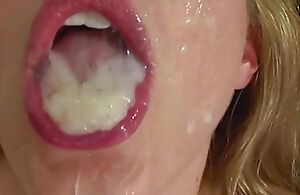 Blonde busty milf swallows a thick cumshot after