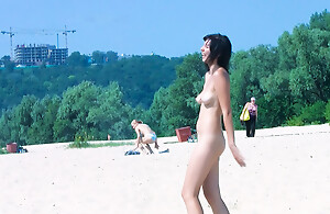 Hot nudist teen filmed by voyeur as she sits naked