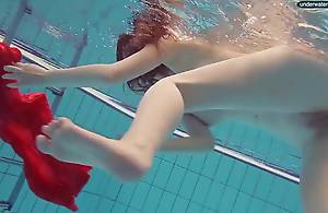 Red Dressed legal age teenager swimming